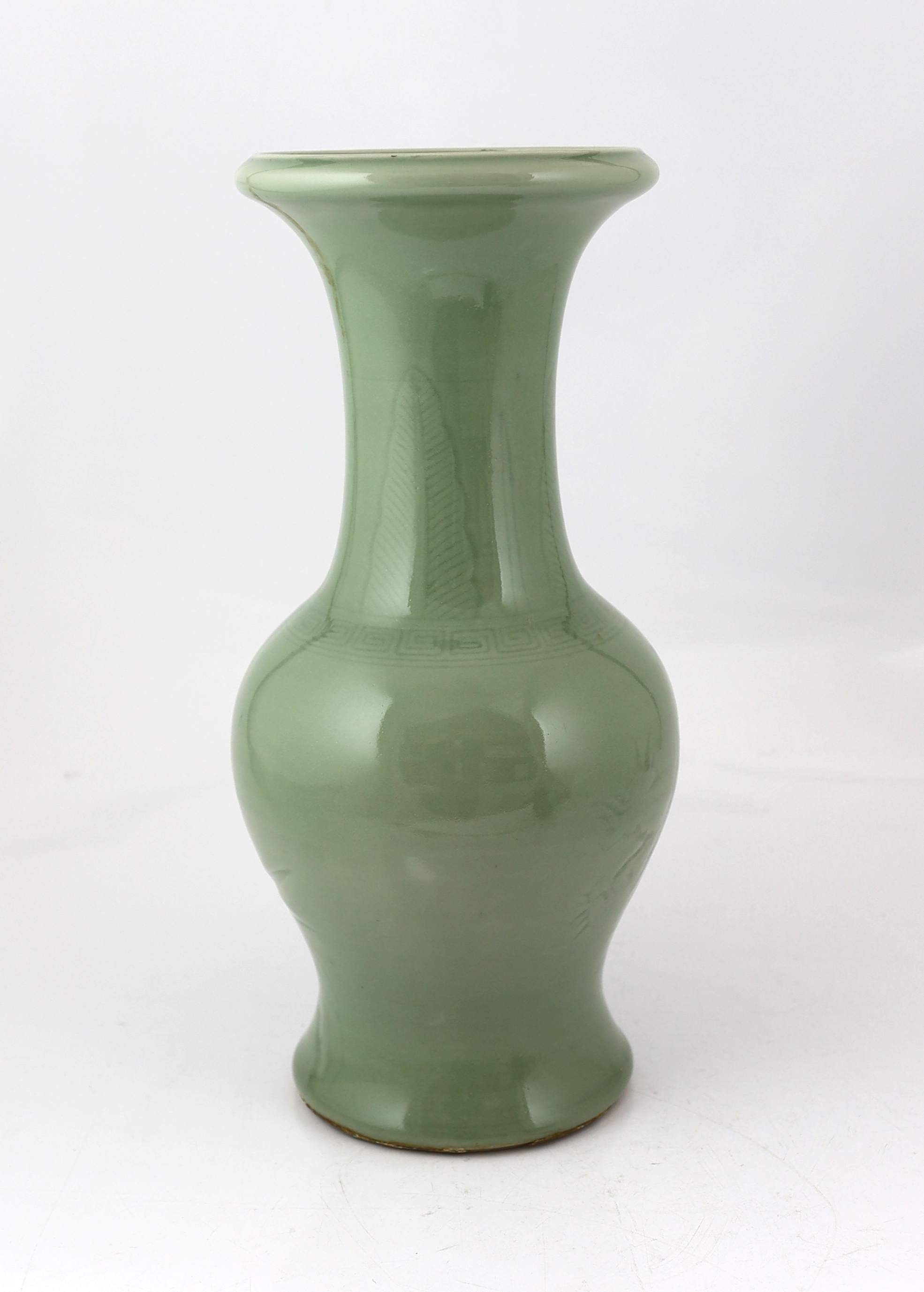 A Chinese carved celadon glazed yen-yen vase, 19th century, base drilled